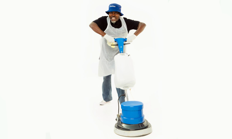 Professional cleaner operating an industrial floor scrubbing machine for commercial and deep cleaning services in Gauteng.